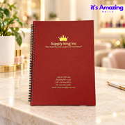 Red-brown spiral appointment book on an ivory salon reception desk