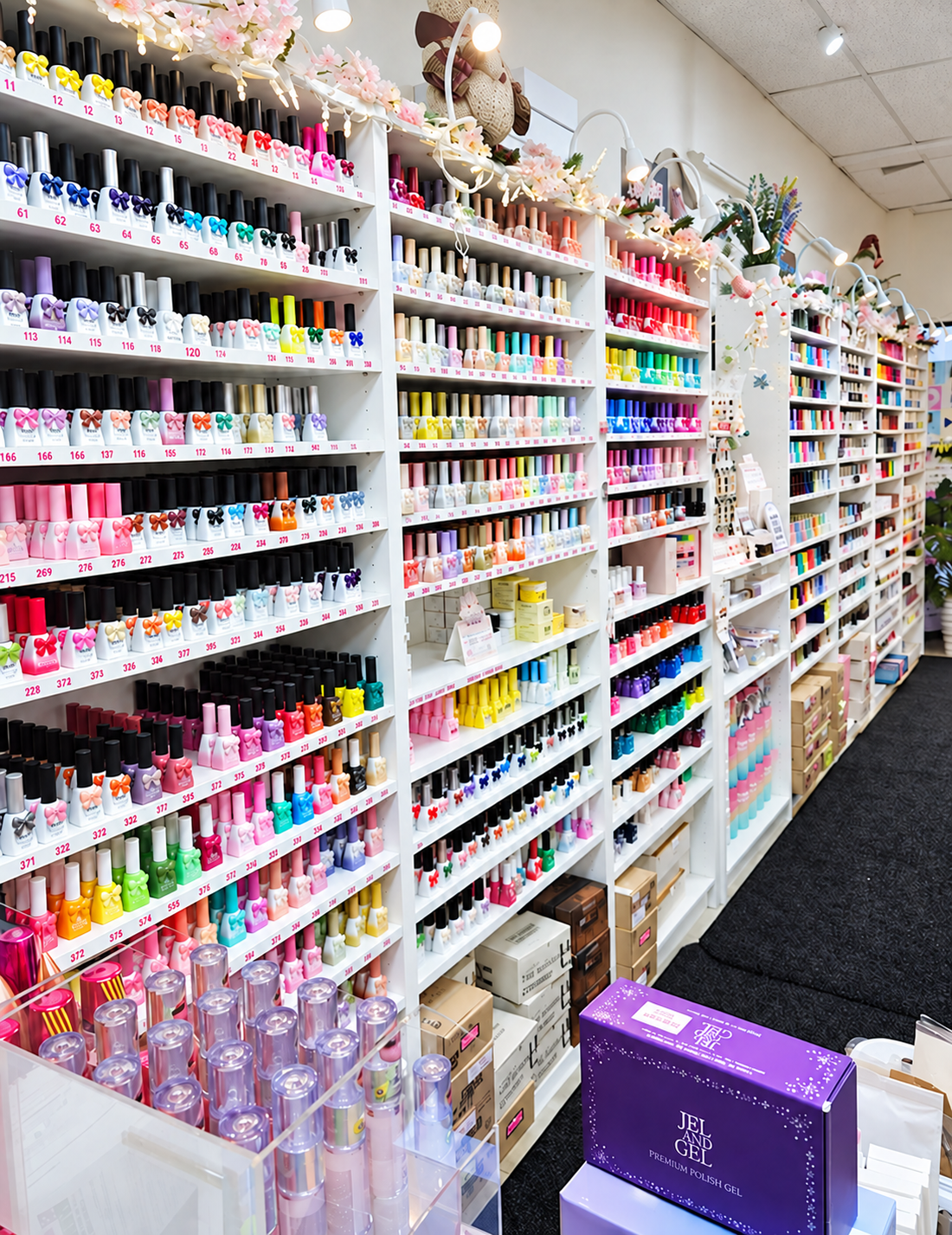 It’s Amazing Nail Supply store interior in Queens, with shelves of nail colors and salon supplies.