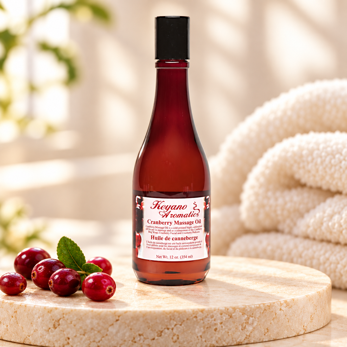 Keyano Cranberry Massage Oil — styled product photo; decorative props not included.