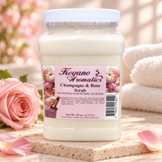 Keyano Champagne & Rose Scrub — styled product photo with decorative spa props