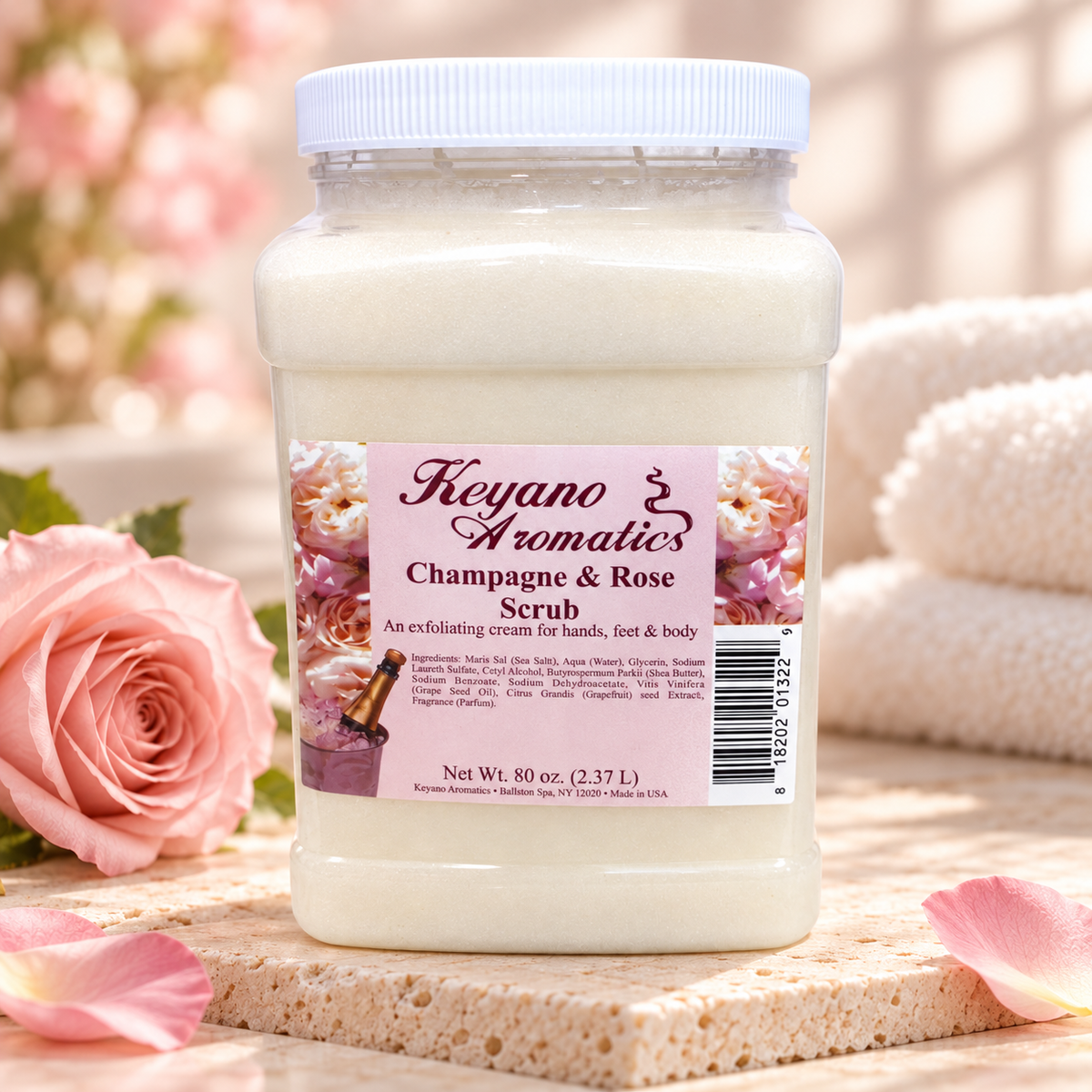 Keyano Champagne & Rose Scrub — styled product photo with decorative spa props